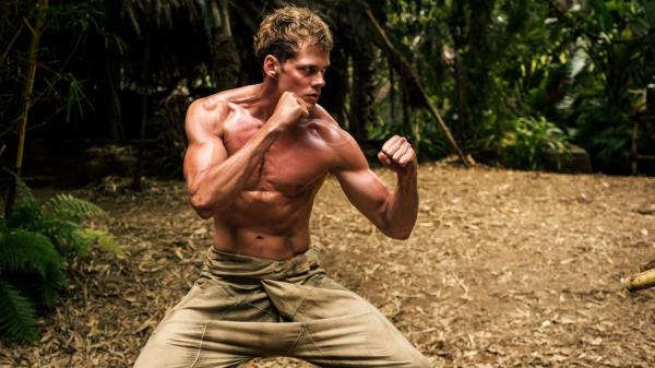 Bill Skarsgard is ripped and fights in Boy Kills World movie