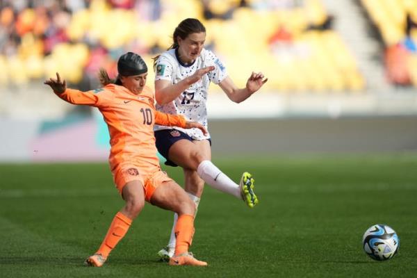 Daniëlle van de Donk of the Netherlands battles Andi Sullivan of the United States for the ball.